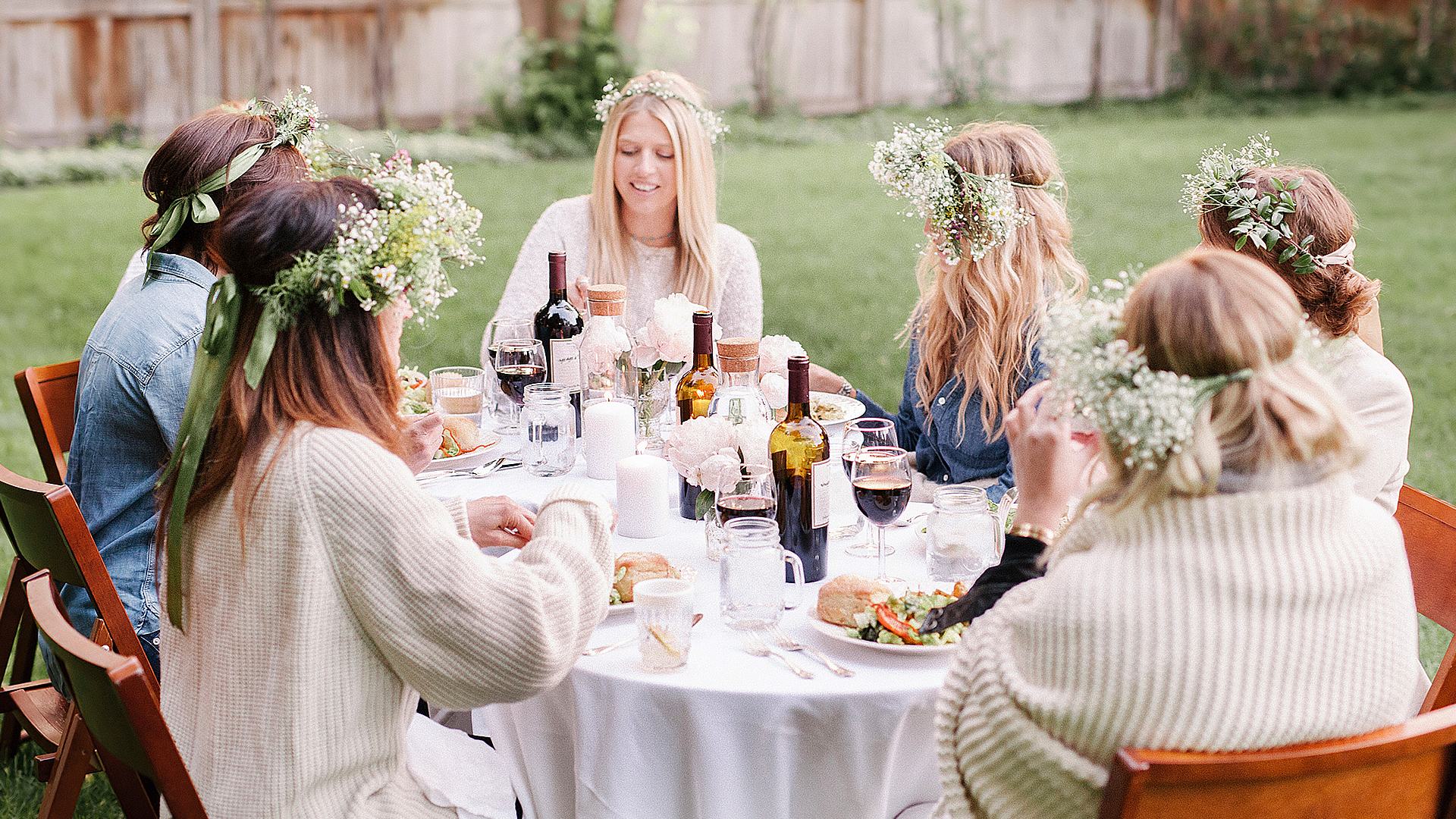 A garden party, showing six women meeting outdoors.